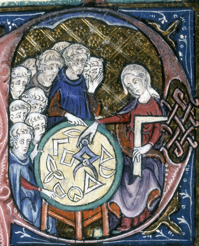 A woman teaching geometry, 1350. On the table are various geometrical shapes or instruments. The pupils crowd round the other side of the table. A boy at the front points to one of the shapes.
