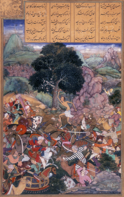 Battle of the tribes watched by Majnun who is holding a rock, 1595. Majnun stands in the centre under a tree, as the two sides fight. The two tribes go to war after Layla's father refuses to let her marry Majnun.