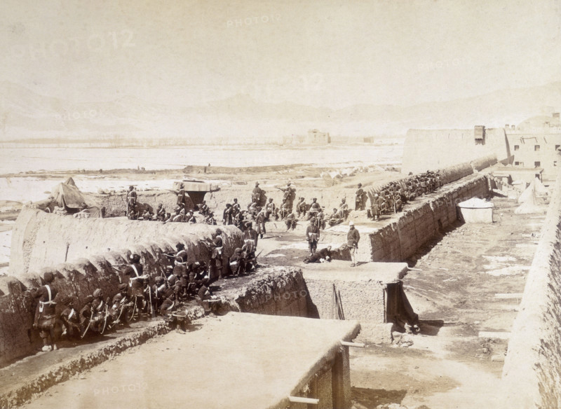 Sapper and Miners Bastion, Sherpur, Kabul, Afghanistan, c1879. Men of the Sapper and Miners unit in the compound, sitting against the wall while a number of soldiers stand guard. Sherpur was a protective compound situated to the north of the city of Kabul. The siege of the Sherpur Cantonment was a battle fought in December 1879, during the Second Anglo-Afghan War. British forces were besieged by Afghan troops, then repulsed an assault.