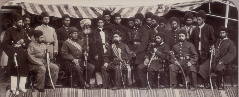 The Amir Yakoob Khan and Sirdars of Kabul at Gandamak, Afghanistan, 29 May 1879. Amir Yakub Khan, son of the overthrown Sher Ali, travelled to Gandamak, a village just outside Jellalabad, to meet the British envoy Sir Louis Cavagnari. The gathering resulted in the signing of the Treaty of Gandamak under which Afghanistan became a British Protectorate, whereby the Amir ceded territories to the British and accepted a British envoy in Kabul. The Amir is seated in the centre. Daoud Shah, from the Ghilzai tribe, his commander-in-chief, sits at his right. Despite the treaty, the war in Afghanistan was not over.