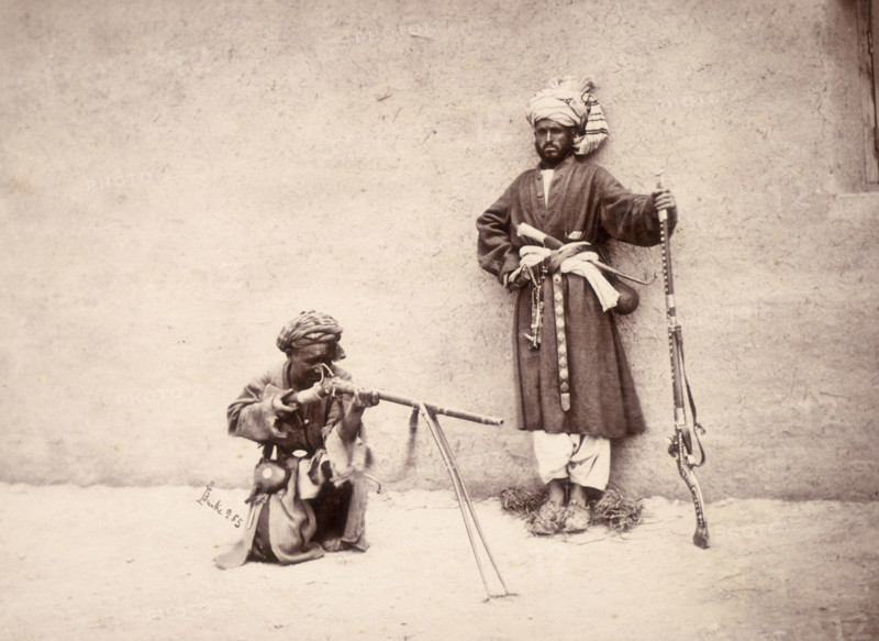 Kohistani and Hazara combatants, Kabul, Afghanistan, c1880. These men are from Kohistan, an area near the Hindu Kush, and from central Afghanistan. The gun of the man on the right has inlaid decoration.