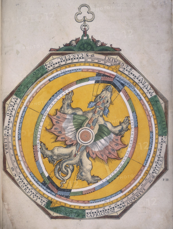 Dragon volvelle, 1540. A volvelle, a movable device for finding the places of the planets within the zodiac. A dragon sits in the middle, showing the latitude of the Moon. Its head and tail, caput and cauda, acquired the status of planets in classical astrology. These points were in fact the lunar nodes, the two places where the moon's path crossed the ecliptic each month.  The dial gives the position of the nodes through the year. The lunar nodes have been referred to as a dragon's head and tail because of a mythological idea that stated the nodes were dragons which ate the moon or sun. From Astronomicum Caesareum.