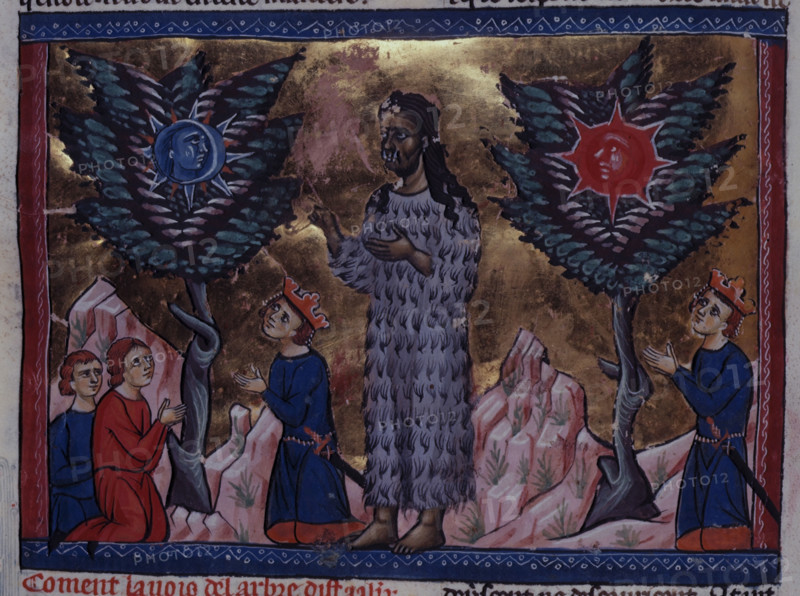 Alexander the Great standing before the oracles of the two trees sacred to the Sun and the Moon, c1285. Other figures kneel at the base of the trees. From Histoire ancienne jusqu'à César. Li Livre des Ansienes Estoires.