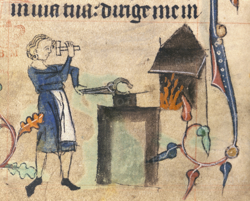 Blacksmith, 15th century. Wearing an apron and hammering a horshoe. A fire can be seen burning in the furnace. The blacksmith also had religious  connections as he was able to create substances from rocks, a reference to God's creation of the world. This image comes from the margins of a book of hours. Scenes of everyday life were often depicted in the books reflecting their everyday use. From a book of hours.