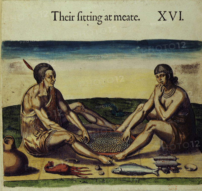 Native Americans preparing food, 1618. Two Native Americans "sitting at meate", with food including fish, squid, nuts and corn. From "Travels through Virginia" by William Strachey. (England, 1618).