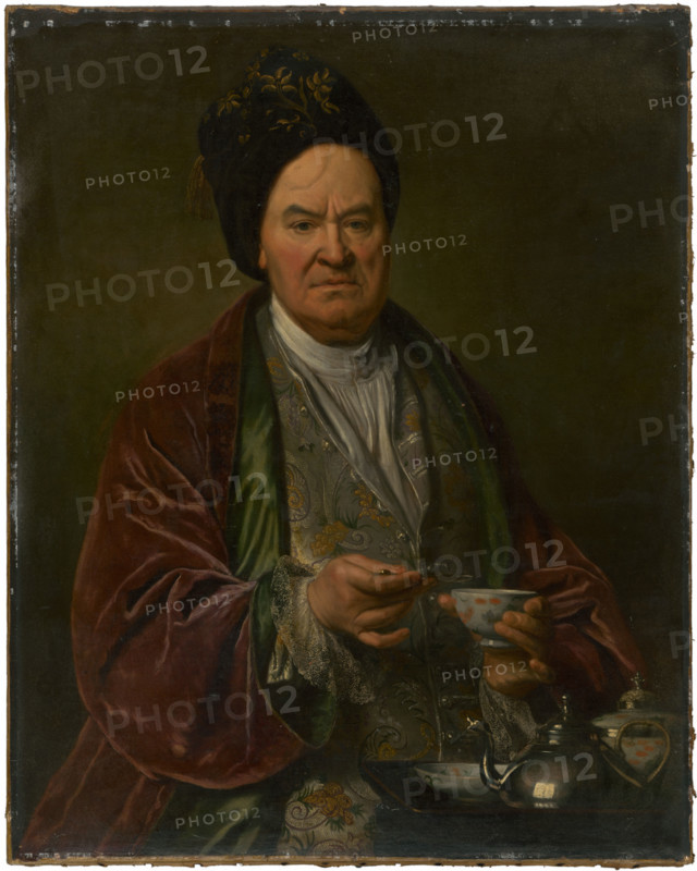 Portrait of a man, 1700-1730. Man wearing a velvet robe holding a teacup. Probably by Ján Kupecký.