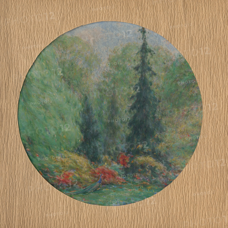 In a park, c1910.