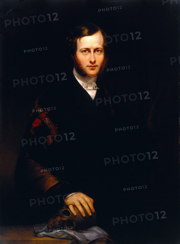 A man (George Dixon Longstaff?) wearing academic robes and holding a skull, 1835. Creator: Carl Schmid.