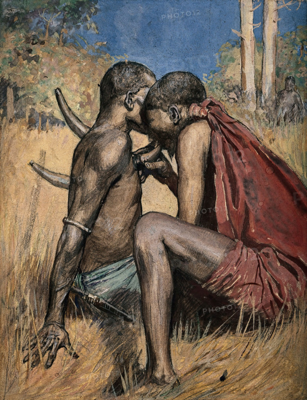 An African medicine man or shaman applying the technique of cupping to a patient... Creator: Unknown.