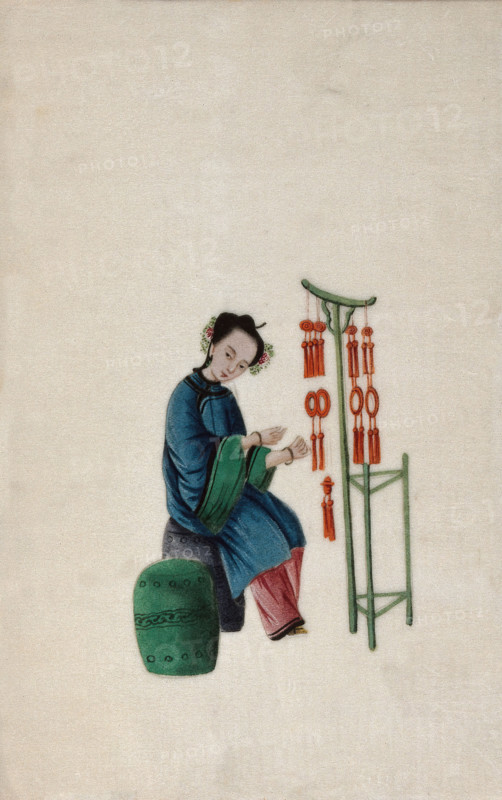 A woman displaying good luck tassels for sale, 1800. Creator: Unknown.