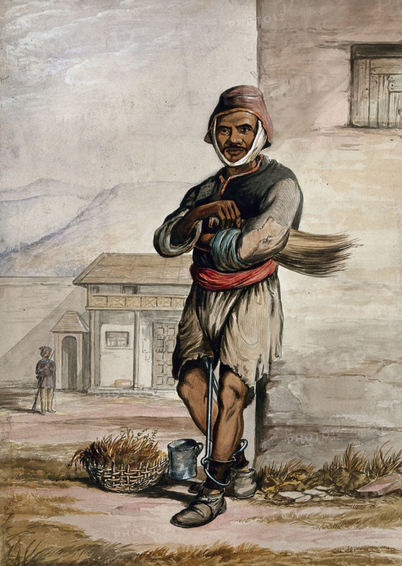 A man of Simla, standing in a prison with manacles around his ankles, 1866. Creator: R Clint.