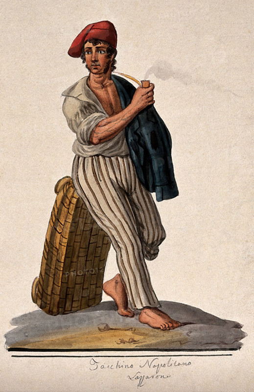 A young man leans against a basket with his jacket slung over his shoulder smoking a pipe. Creator: Unknown.
