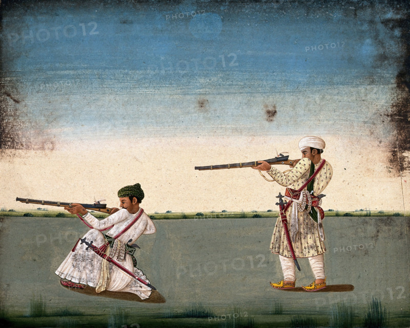 Two Indian soldiers (?) take aim and fire their rifles, (between 1800 and 1899?). Creator: Unknown.