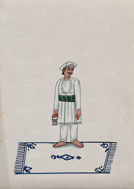 A servant standing on a carpet holding a bunch of keys, (between 1800 and 1899?). Creator: Unknown.