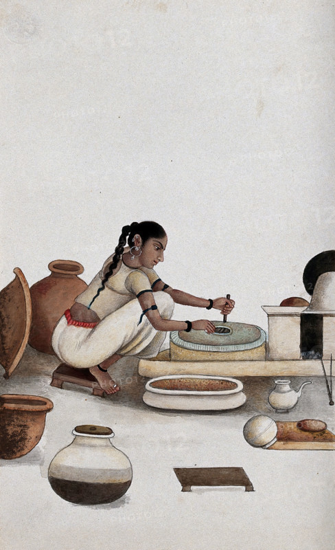 Delhi: a woman grinding grain into flour, (between 1800 and 1899?). Creator: Unknown.
