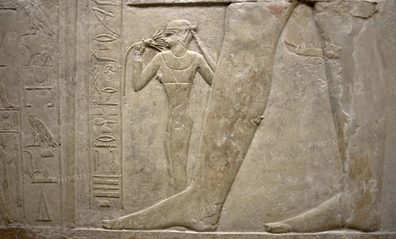Relief of legs of Mereruka with his wife Watetkhethor..., Mastaba of Mereruka, Egypt, 2003.   Creator: Unknown.