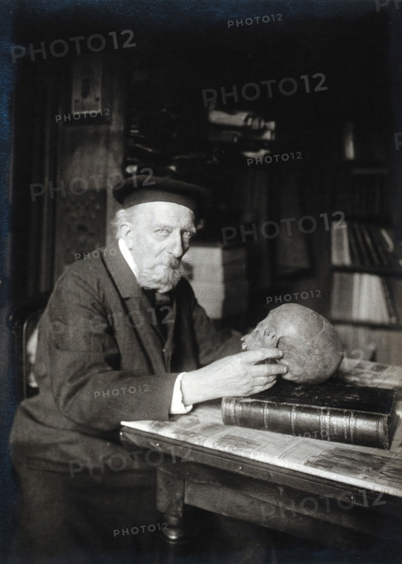 Adrien de Mortillet, holding a skull. Creator: Unknown.