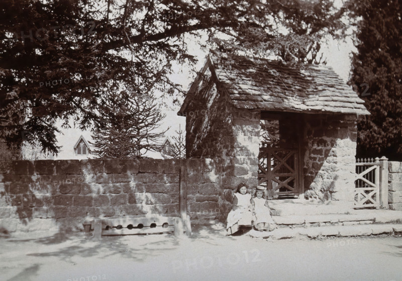 Mitchel Troy, Wales: lich-gate and stocks outside the church, c1890. Creator: Unknown.