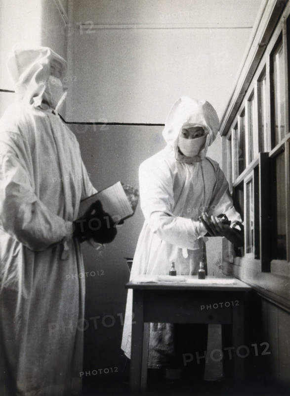 The inoculation of an isolated plague patient in China, c20th century. Creator: Unknown.
