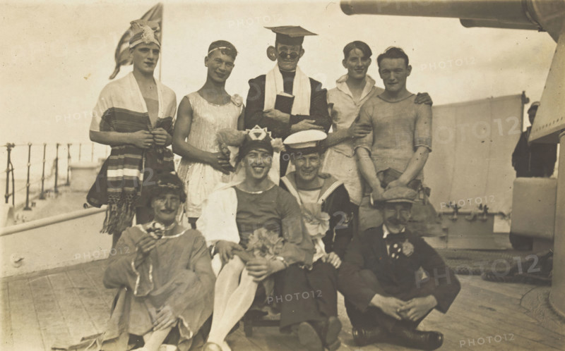 Nine men dressed up on deck, [between 1920 and 1929?]. Creator: Unknown.