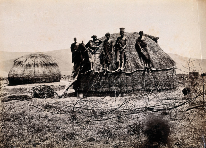 Africa: a group of African people standing on a kraal hut, between 1800 and 1899. Creator: Unknown.