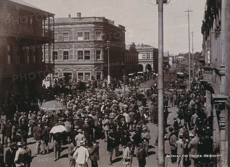 South Africa: a crowd of people gathered for trading in a chained off area outside the..., 1896. Creator: Barnett.