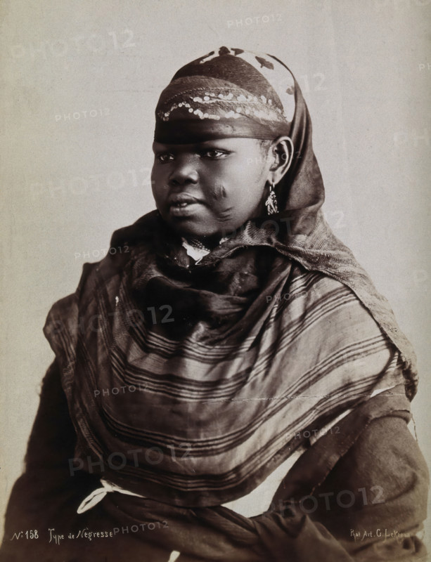 A North African woman with scarification on her cheeks, c1900. Creator: Gabriel Lekegian.