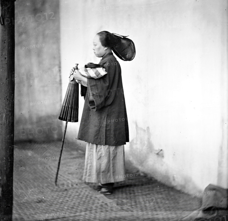 Canton, Kwangtung province, China: a lady holding a parasol, 1869. Creator: John Thomson.