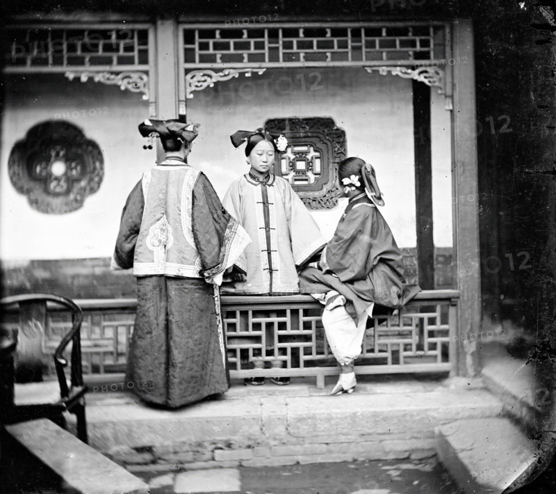 China: three Manchu ladies inside a courtyard, Beijing, 1869. Creator: John Thomson.