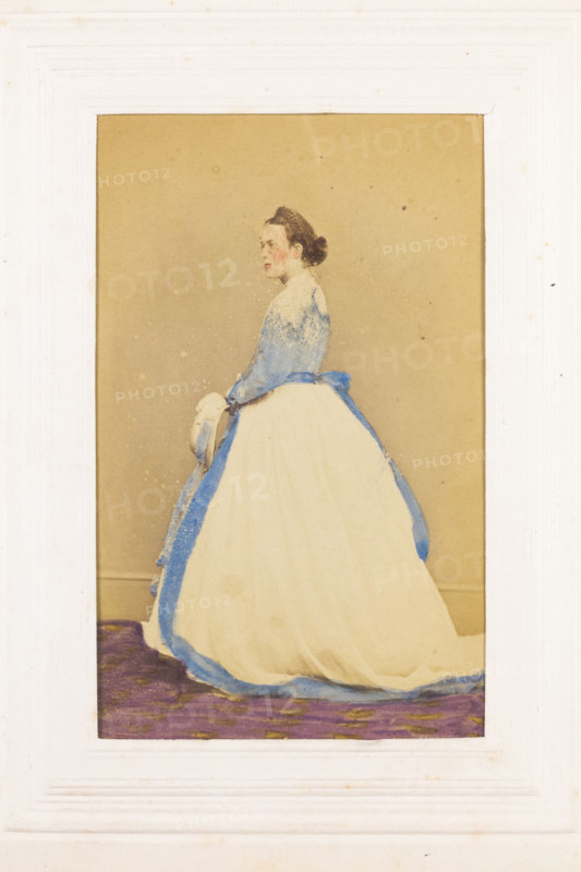 A man in drag standing side-on, [between 1890 and 1899?]. Creator: Unknown.