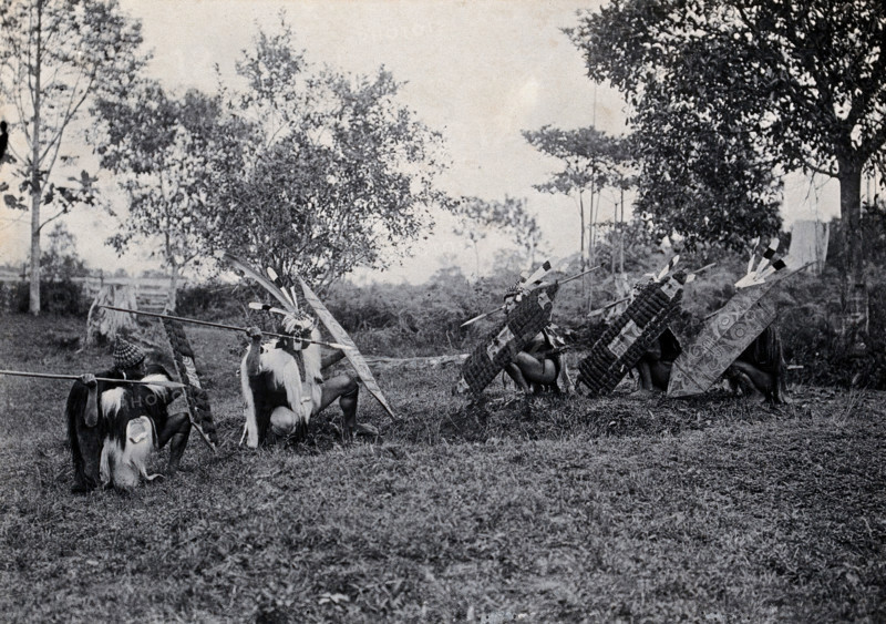 Sarawak: five Kenyah warriors in a warfare ritual, c1900. Creator: Unknown.