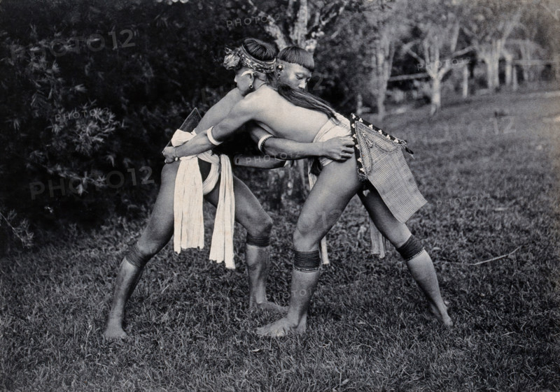 Sarawak: two Kayans wrestling, c1900. Creator: Unknown.