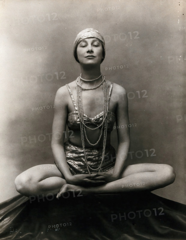 Marguerite Agniel posing with her legs crossed and hands together resting on her legs, 1929. Creator: Unknown.