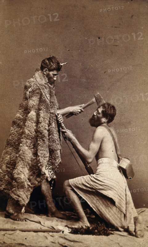 Two Maori men, simulating armed attack with a hatchet and a spear(?), c1880s. Creator: Unknown.