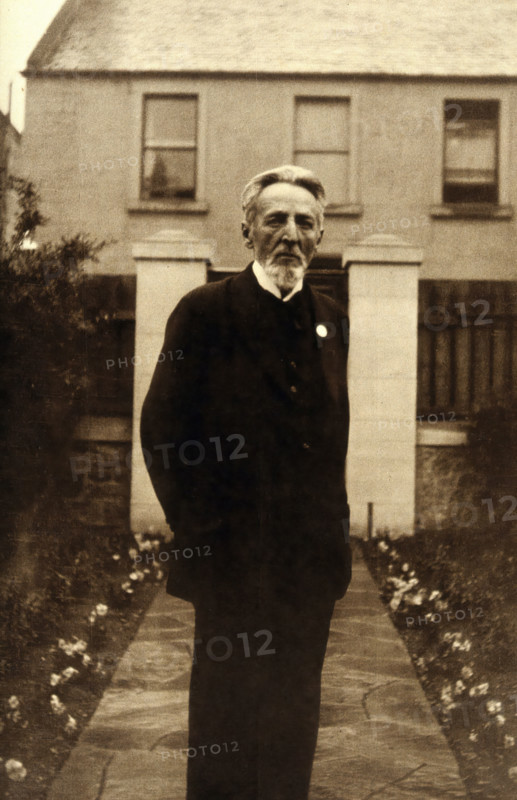 An unidentified man, standing in a garden, c1900. Creator: Unknown.