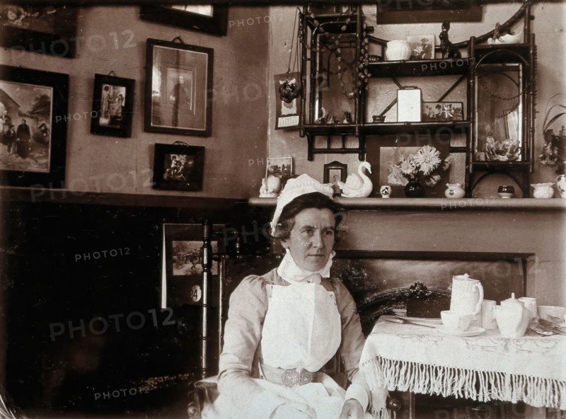 St Bartholomew's Hospital, London: a nurse taking tea, c1890. Creator: Unknown.