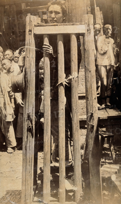 China: a man standing in a locked cage as a method of slow torture or execution, 19th century. Creator: Unknown.