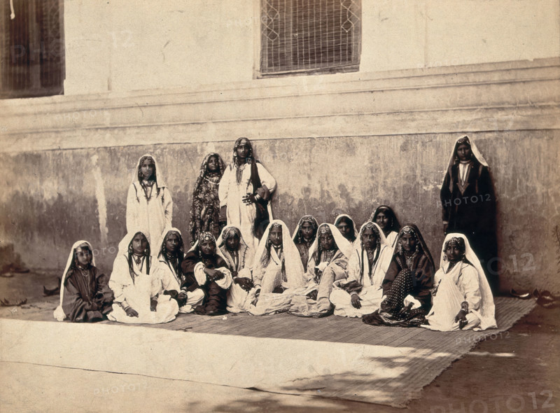 Kashmiri women in traditional dress: group portrait, c1900. Creator: Unknown.