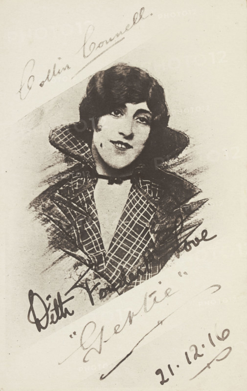 An man in drag as "Gertie" wearing a checked coat, 1916. Creator: Unknown.