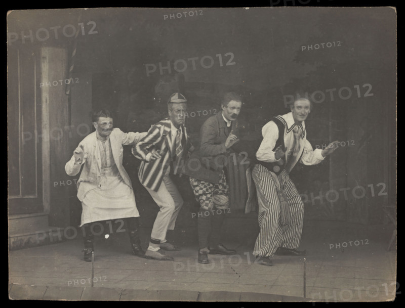 Sailors on stage in mid-pose, wearing a variety of costumes, [between 1910 and 1919?]. Creator: Unknown.