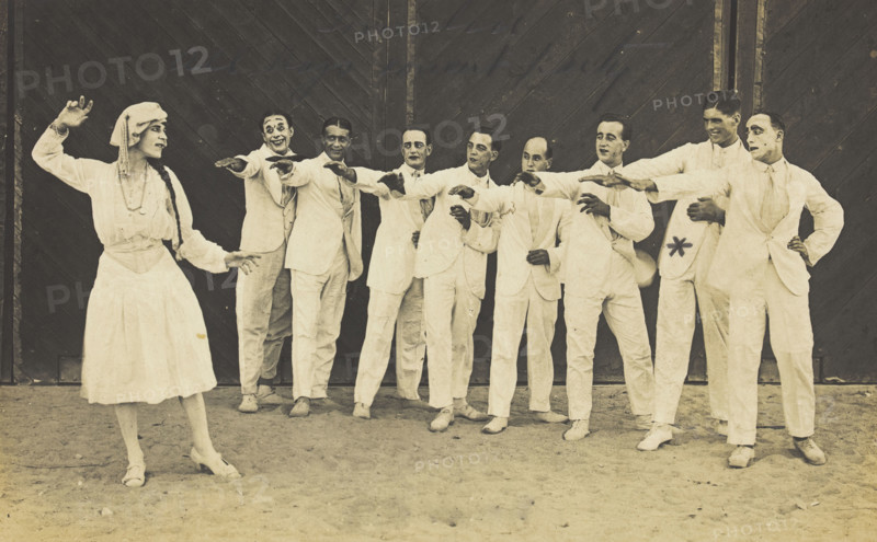 Actors, one in drag, performing on stage as "The Curios",  c1918-1920. Creator: Unknown.