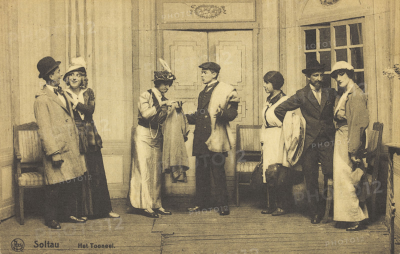 Actors, some in drag, performing at a prisoner of war camp in Belgium, (between 1910 and 1919?). Creator: Unknown.