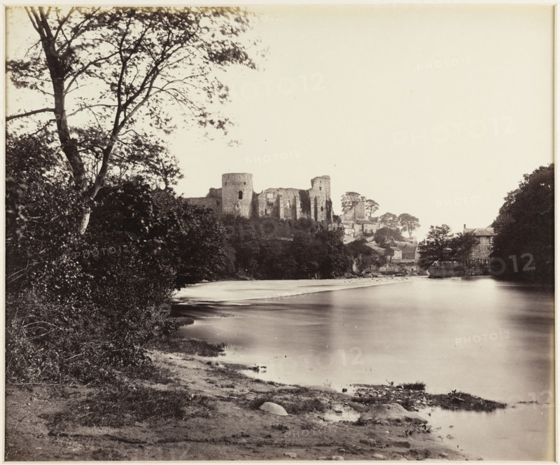 A view looking along the River Tees towards the ruins of Barnard Castle, 1860s. Creator: James Mudd.