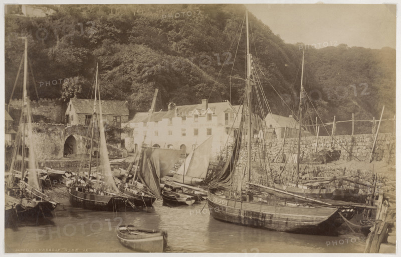 Fishing boats in the harbour at Clovelly, seen from the Pier, with the Red Lion Hotel..., c1885. Creator: James Valentine.
