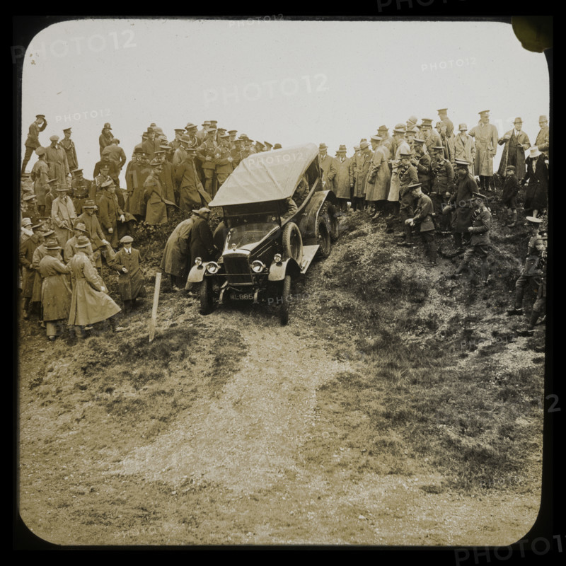 A six-wheeled car, possibly an early Morris Commercial 6x4, driving down a slope..., 1926-1929.  Creator: Norman Kingsley Harrison.
