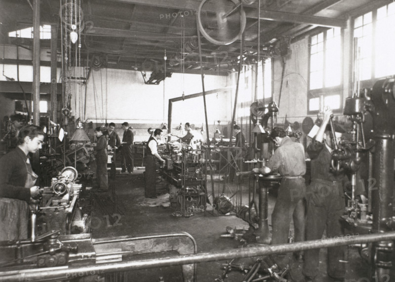 Production line of a company who manufacture motorcycle components, Barcelona, Spain, 1945.  Creator: Unknown.