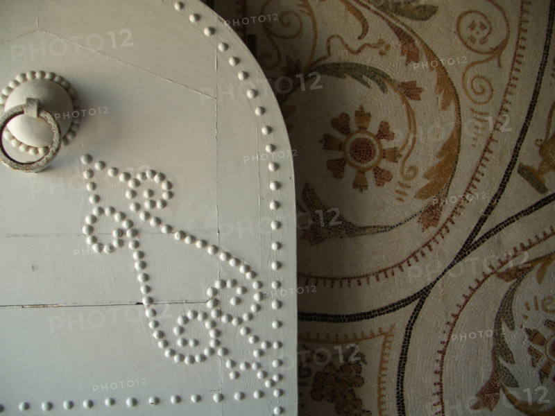 Studded door and mosaic, El Jem Museum, El Djem, Tunisia, 2009. Creator: Amanda Waite.
