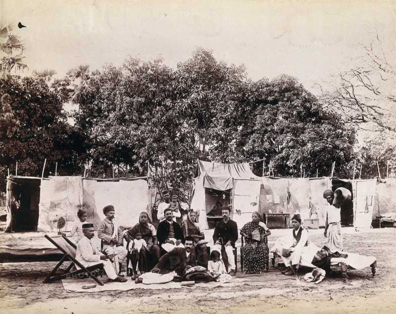 An affluent family forced to leave their home due to plague in their neighbourhood sitting...1896/7. Creator: Unknown.
