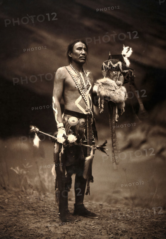 A Navajo man in ceremonial dress representing the Yebichai god Zahabolzi (Zahadolzha?), 1904. Creator: Edward Sheriff Curtis.