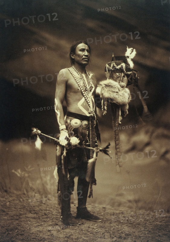 A Navajo man in ceremonial dress representing the Yebichai god Zahabolzi (Zahadolzha?), 1904. Creator: Edward Sheriff Curtis.